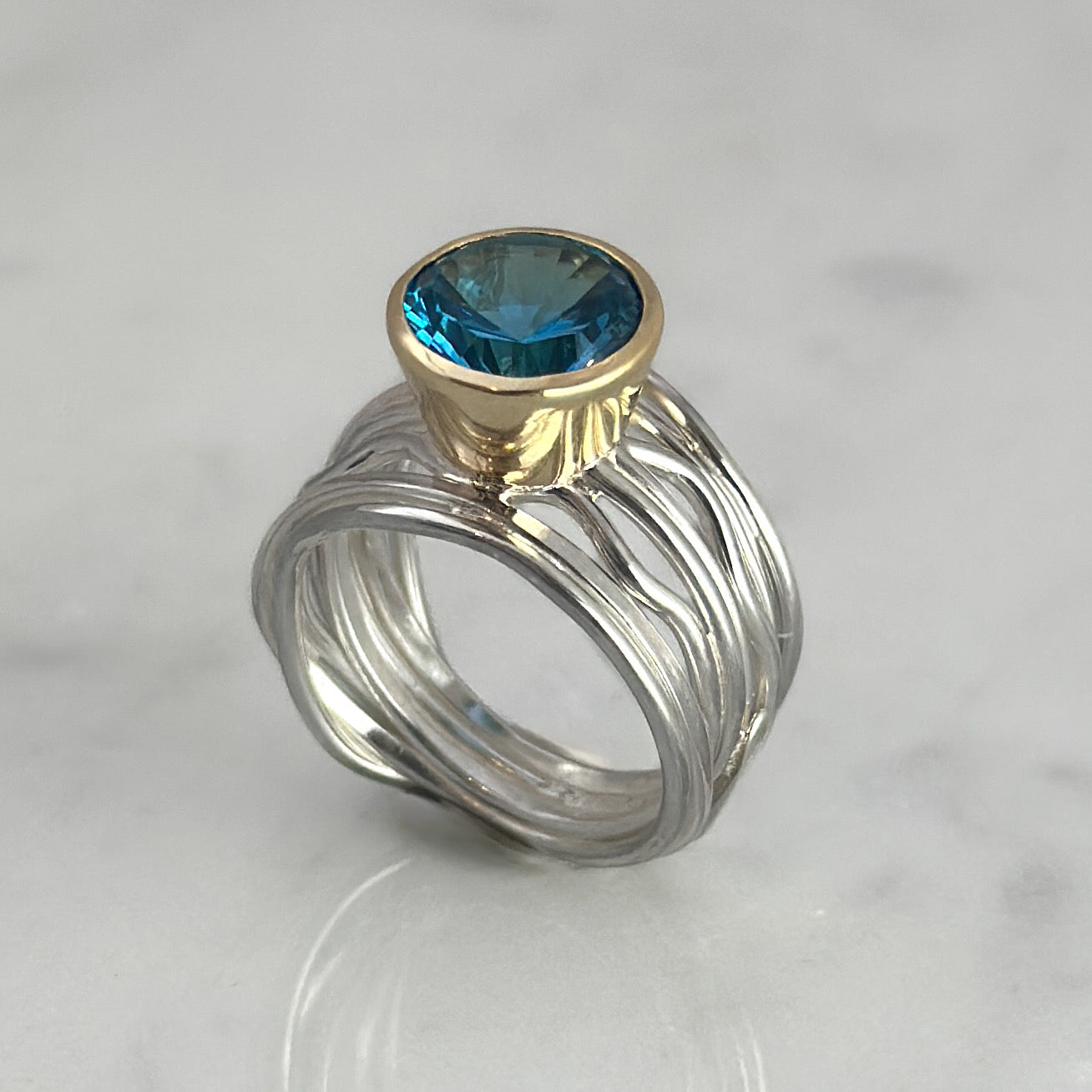 Silver and Gold Flowing Ring with Topaz