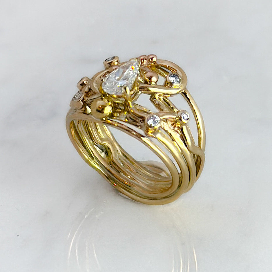 Gold (9ct) Flowing Ring with Pear cut Diamond