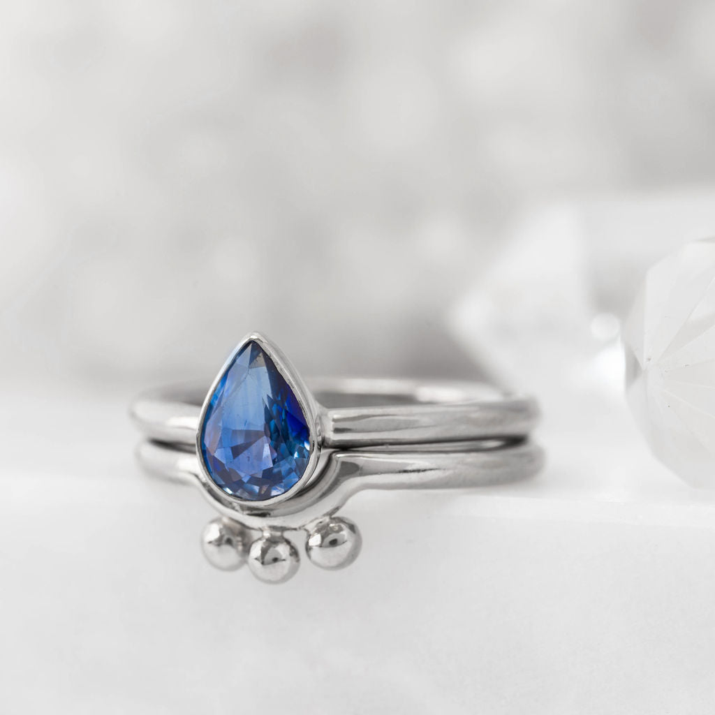 Platinum and Pear Sapphire Nestle Ring