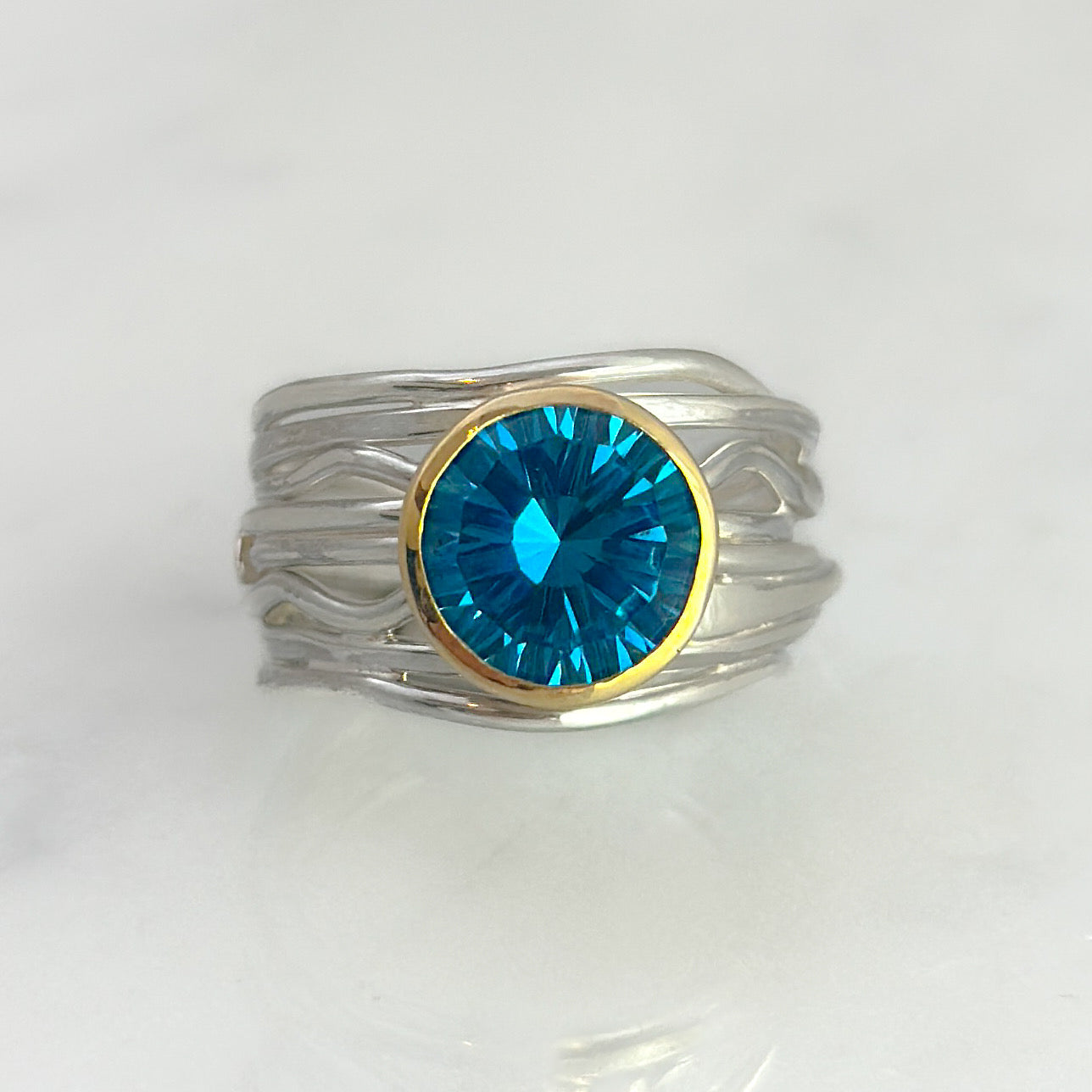 Silver and Gold Flowing Ring with Topaz