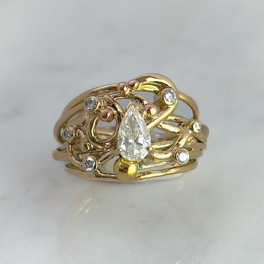 Gold (9ct) Flowing Ring with Pear cut Diamond